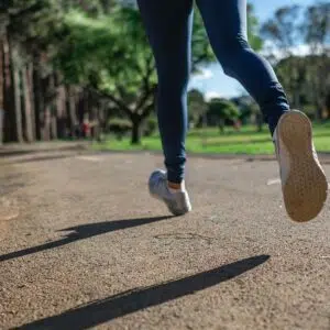 Close up on the running shoes of a person running