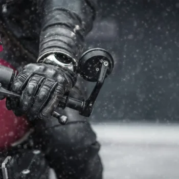 rider on motorcycle pressing the brakes in winter