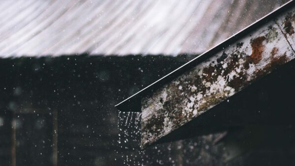 Corrugated Metal Sheet of House during Rainy Daytime