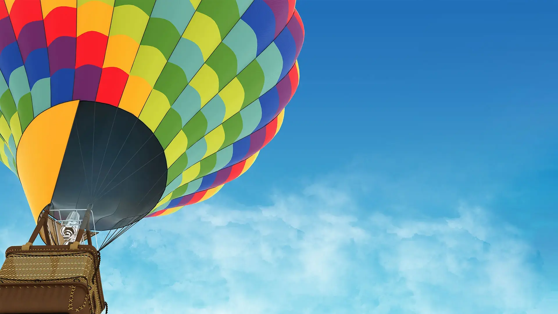 hot air balloon in the blue sky with clouds