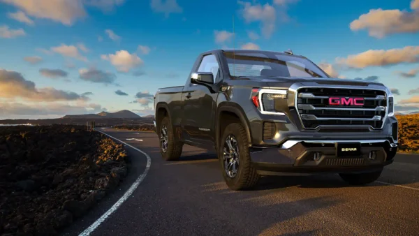 gmc sierra truck on roadway with blue skies in the background