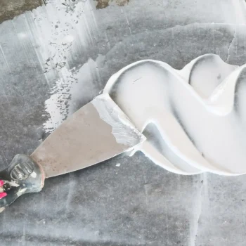 putty knife with drywall mud