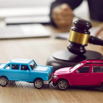 toy cars in pretend accident with judge gavel