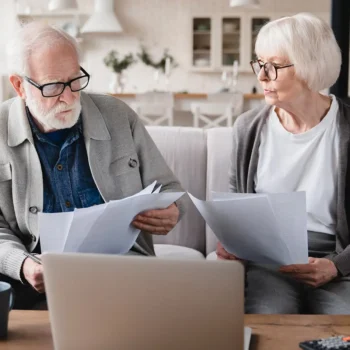 elderly couple going over bill payments