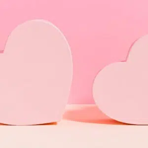 two hearts on a pink background