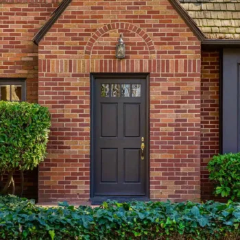 front view of brick house with black front door