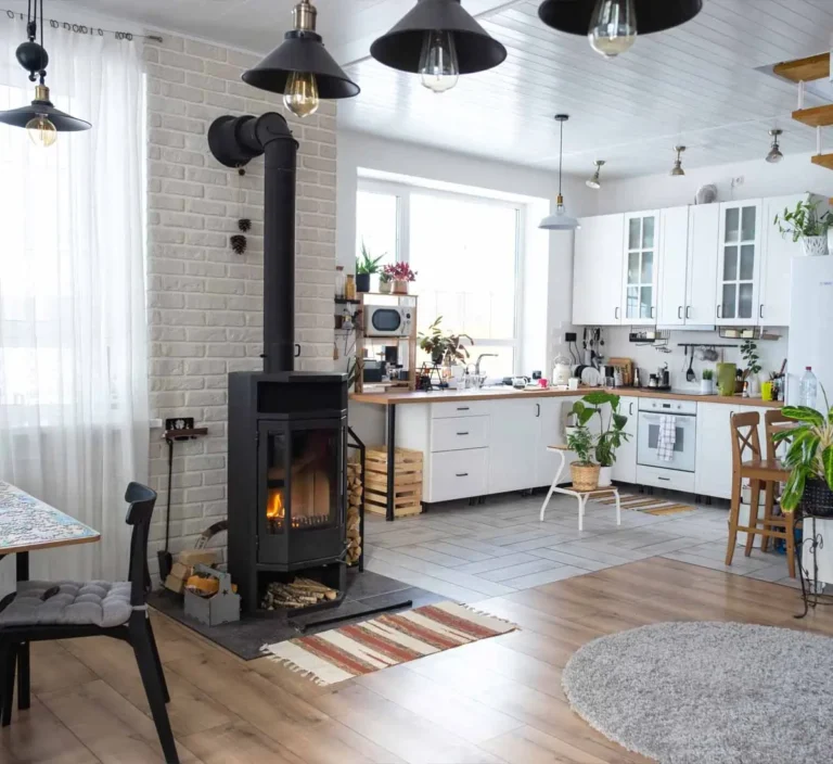 Interior of high-risk home with wood stove and hanging lights.