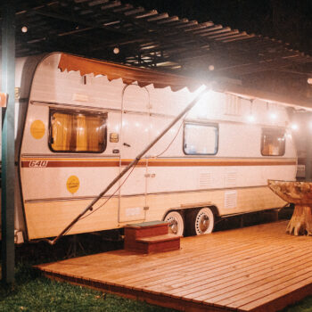 white camper van parked under roof