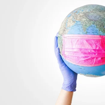 globe wearing a surgical mask