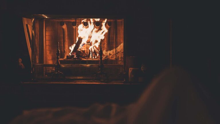 Burning fireplace with roaring fire