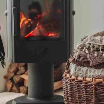 cottage wood stove and blanket basket with pink chair