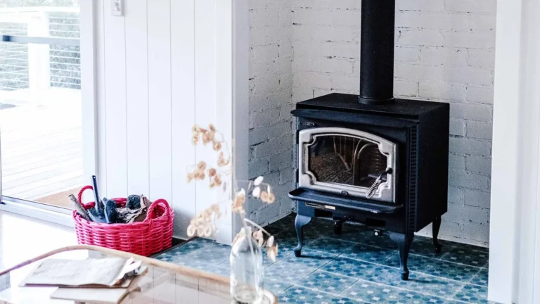 wood burning stove in room with pink basket