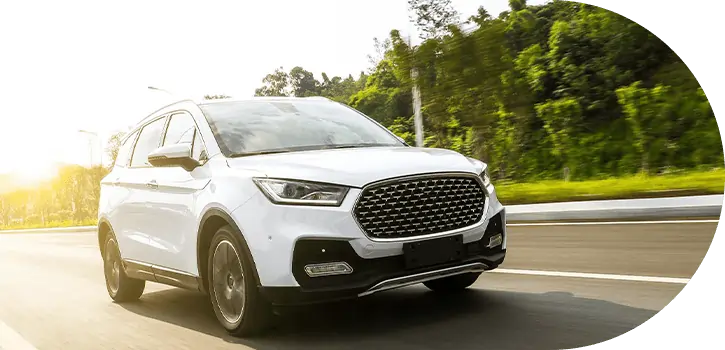 White SUV driving on the road