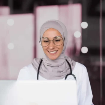 Doctor conducting administrative work at a desk.