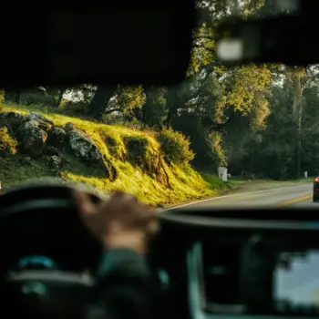 Driver driving behind a car.