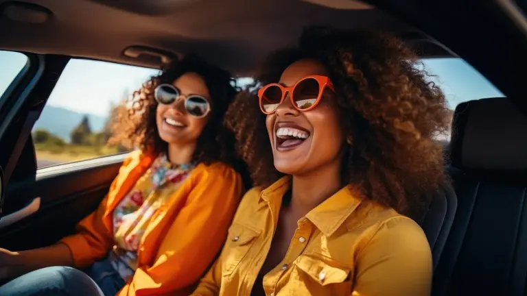 Two women parked in their car.