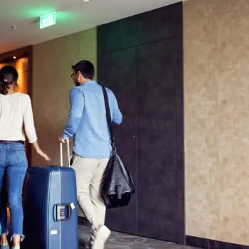 Couple checking into a hotel.